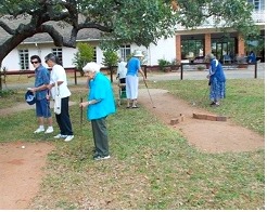Residents playing croquet on the lawn